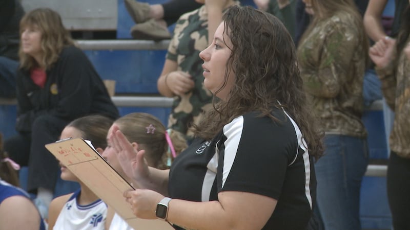 Fort Defiance head coach Amber Pitsenbarger claps after an Indians point during the VHSL Class...