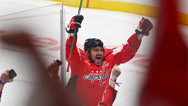 FILE -- Washington Capitals left wing Alex Ovechkin (8) celebrates his 900th NHL career goal...
