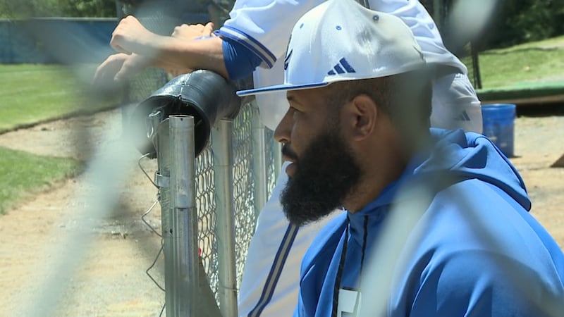 Spotswood head coach Marcus Davis looks on from the dugout during the VHSL Region 3C...