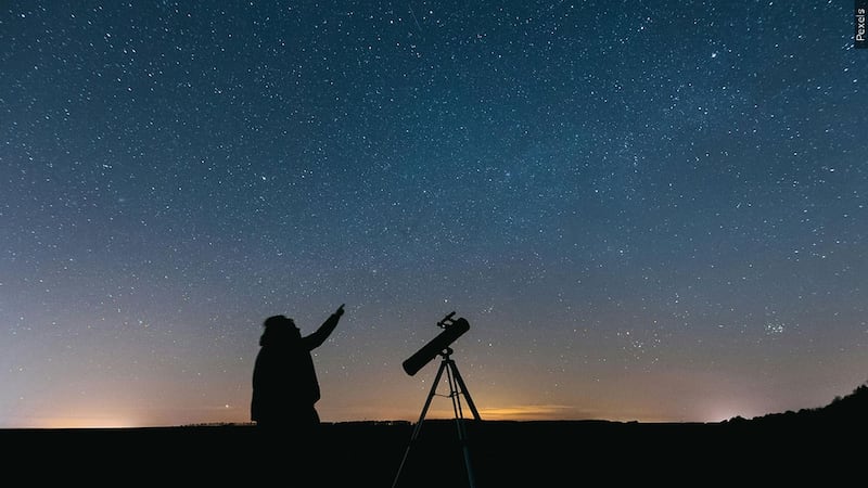 PHOTO: Silhouette of person standing near telescope, Photo Date: 06/26/2021