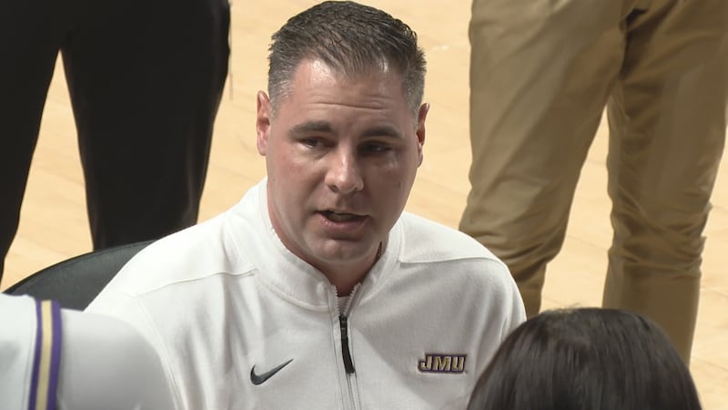 James Madison head coach Preston Spradlin on the bench before a men's basketball game against...