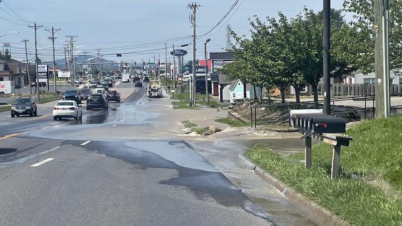 Crews are working to address a waterline break on South Main Street in Harrisonburg on Friday...